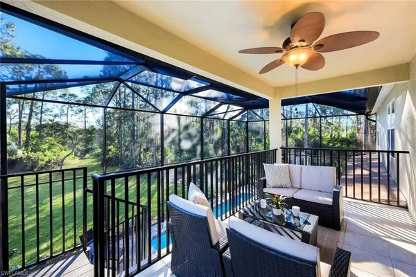 a view of a porch with furniture and a window