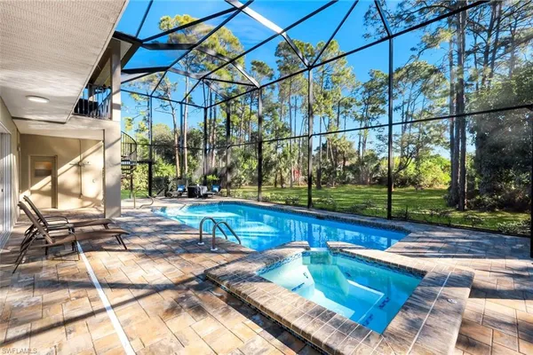 a view of a swimming pool with a patio