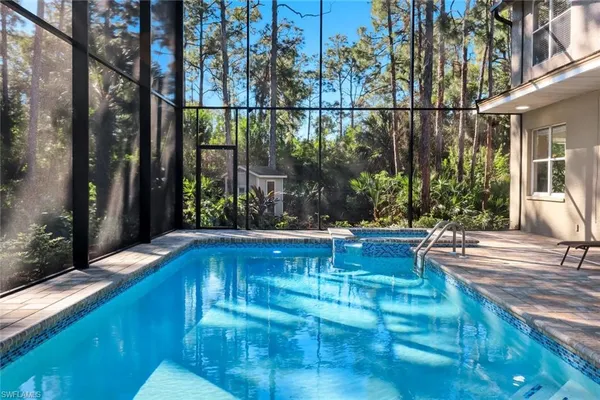 a view of swimming pool with patio
