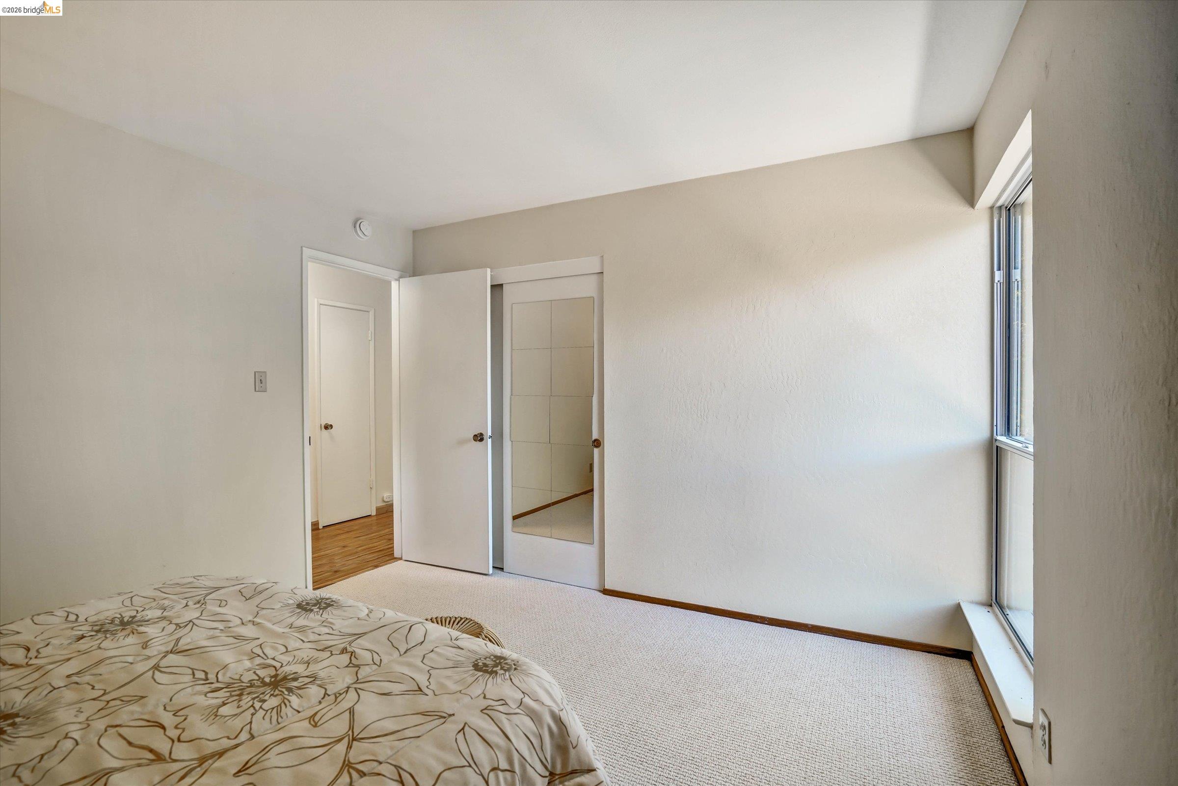 2826 Wright Avenue Pinole, CA 94564 - Photo 26 of 70 Carpeted interior room with a window, white walls, and white trim