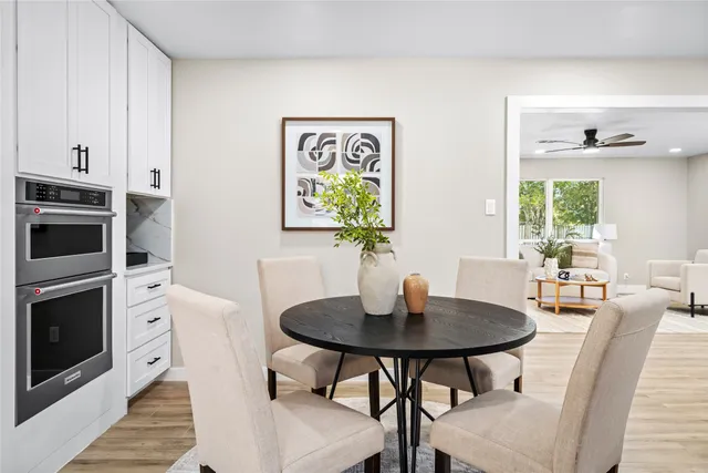 a spacious bathroom with double sink shower and mirror