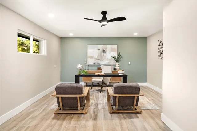 a bathroom with a tub shower and mirror