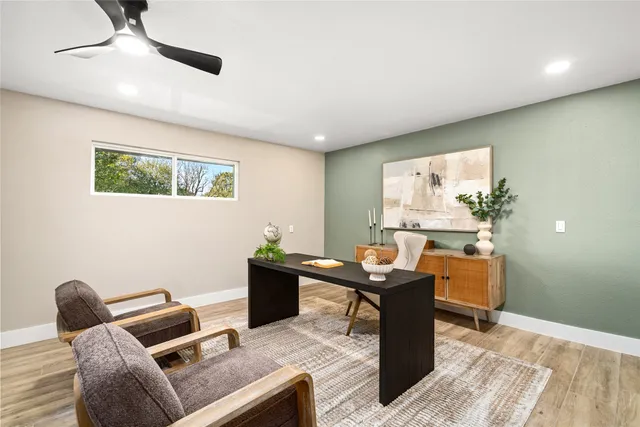 a bathroom with a tub sink and mirror
