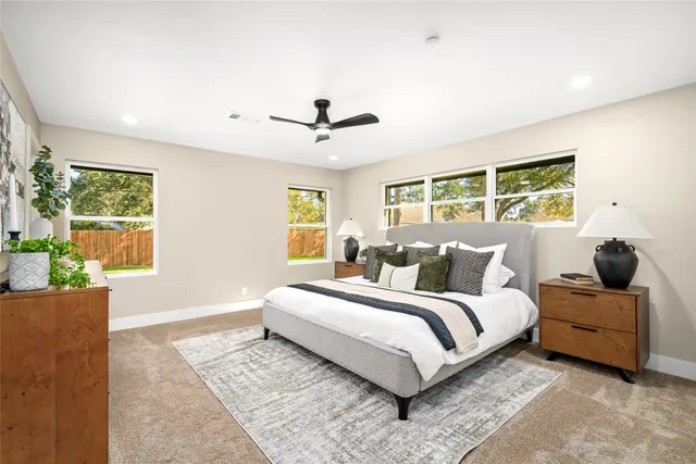 a view of a house with backyard and garden