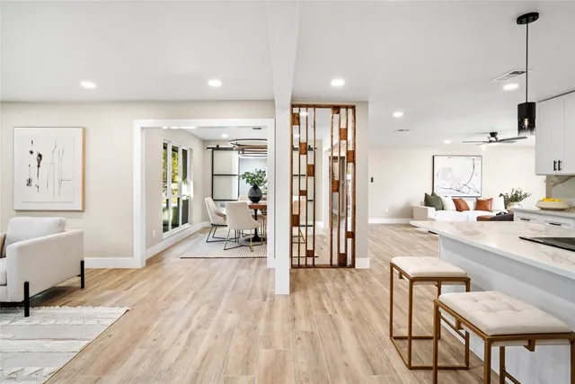 a kitchen with a dining table and chairs