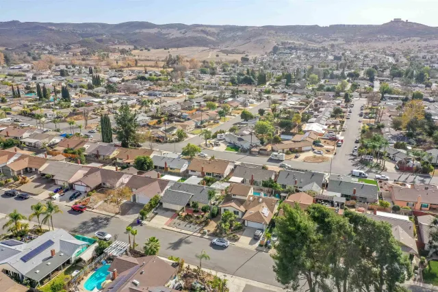 an aerial view of residential houses and outdoor space