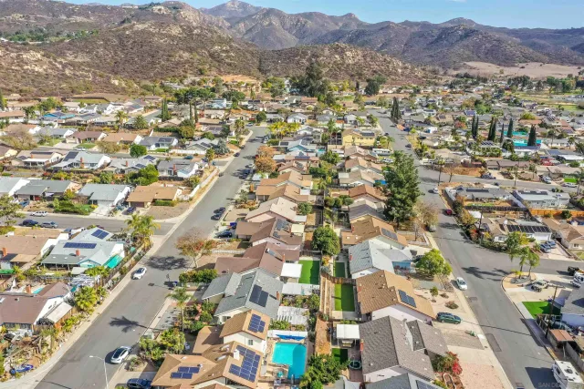 an aerial view of residential houses with outdoor space