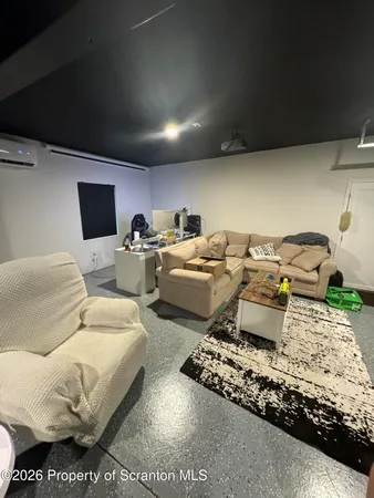 a living room with furniture gym equipment and a view of living room