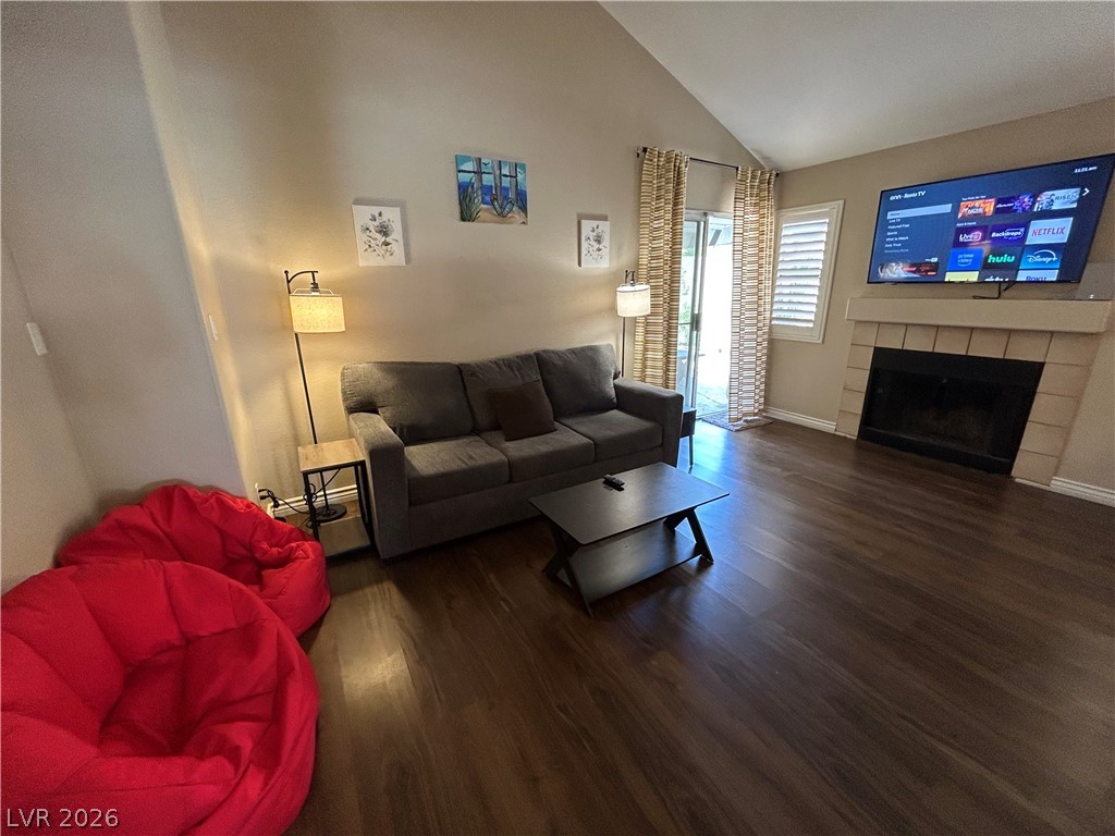 267 Westwind Road Henderson, NV 89074 - Photo 3 of 16 A well-lit living space features a fireplace and direct access to outdoor serenity.