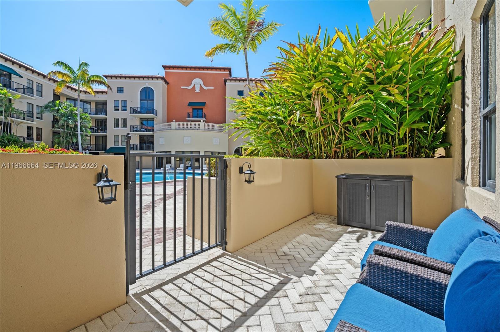 55 Merrick Way, Unit 507 Coral Gables, FL 33134 - Photo 1 of 28 a view of a house with a balcony and wooden floor