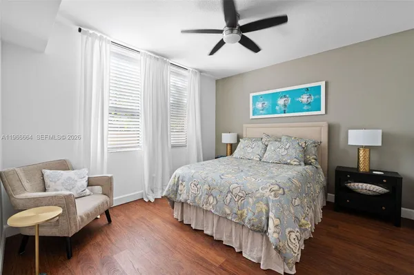 a bedroom with a bed and a couch