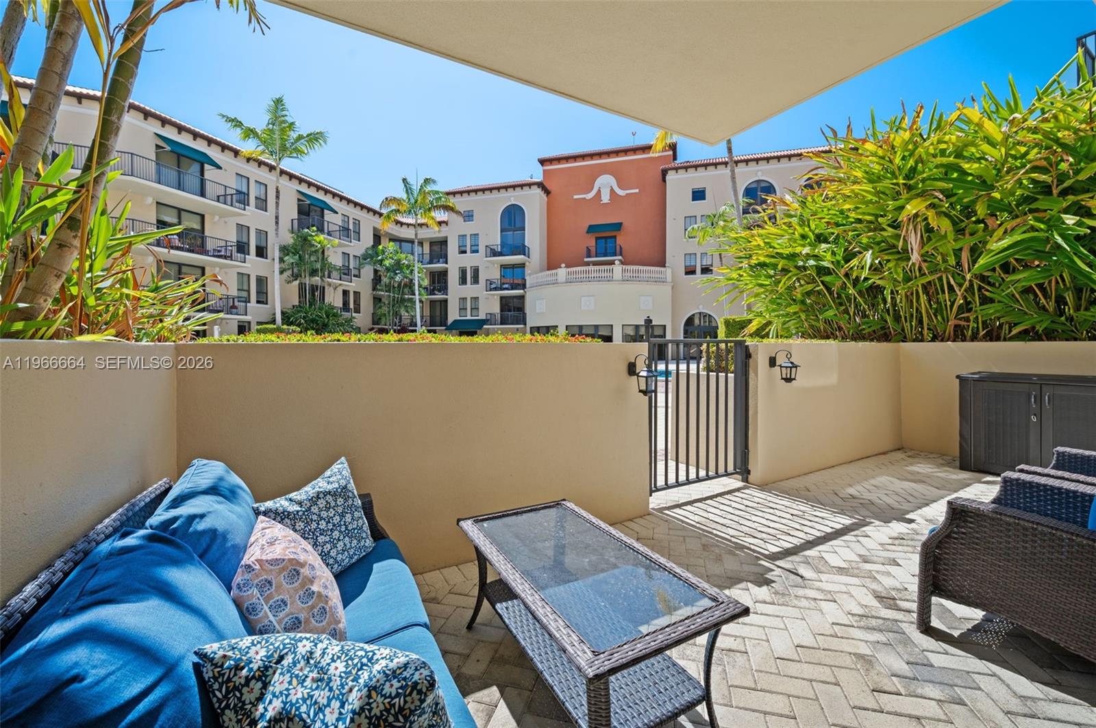 55 Merrick Way, Unit 507 Coral Gables, FL 33134 - Photo 18 of 28 a living room with furniture and a potted plant