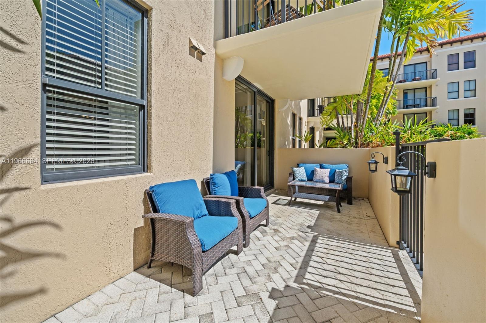 55 Merrick Way, Unit 507 Coral Gables, FL 33134 - Photo 19 of 28 a building outdoor space with patio furniture