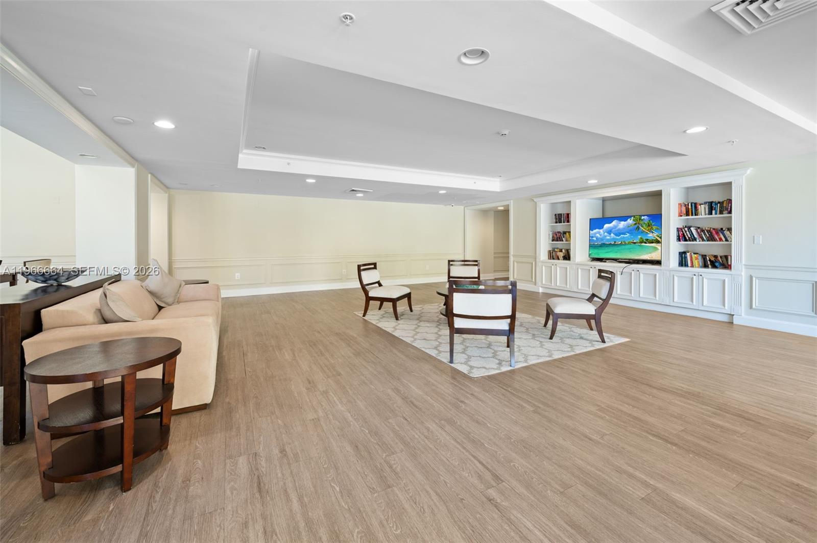 55 Merrick Way, Unit 507 Coral Gables, FL 33134 - Photo 20 of 28 a living room with furniture and wooden floor