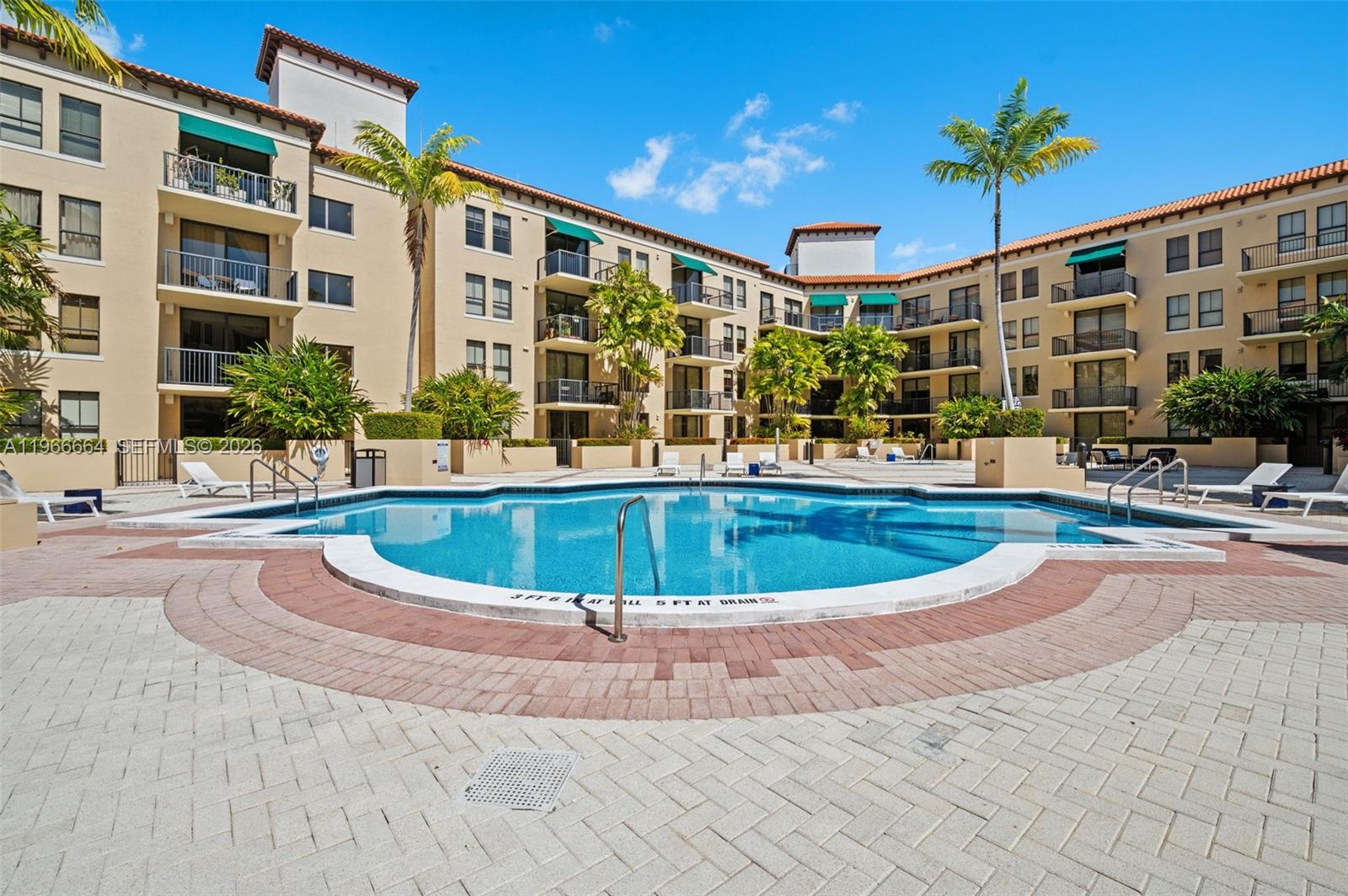 55 Merrick Way, Unit 507 Coral Gables, FL 33134 - Photo 24 of 28 a view of a building with a swimming pool