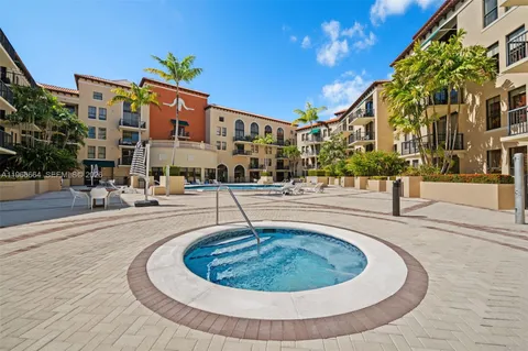 a swimming pool with outdoor seating and yard
