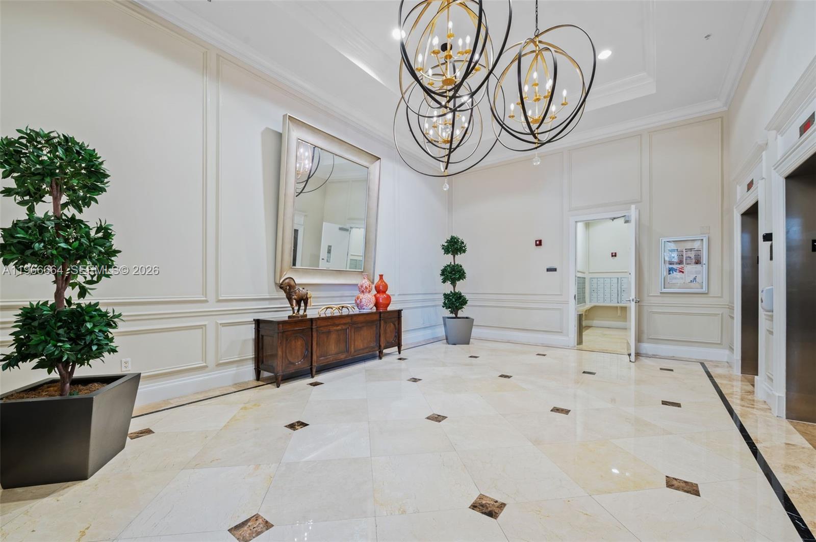 55 Merrick Way, Unit 507 Coral Gables, FL 33134 - Photo 28 of 28 a spacious bathroom with a potted plant a sink and a mirror