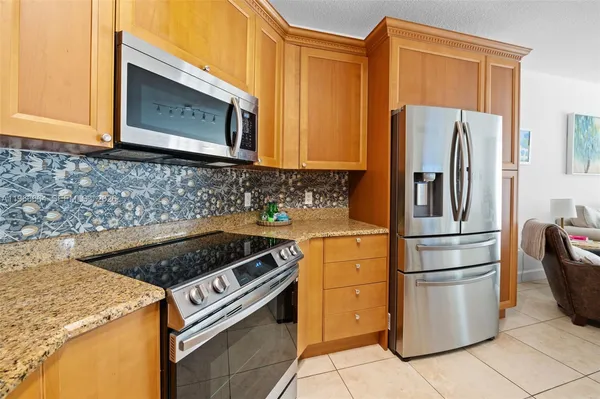 a kitchen with a stove microwave and refrigerator