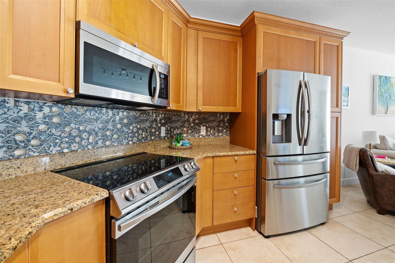 55 Merrick Way, Unit 507 Coral Gables, FL 33134 - Photo 8 of 28 a kitchen with a stove microwave and refrigerator