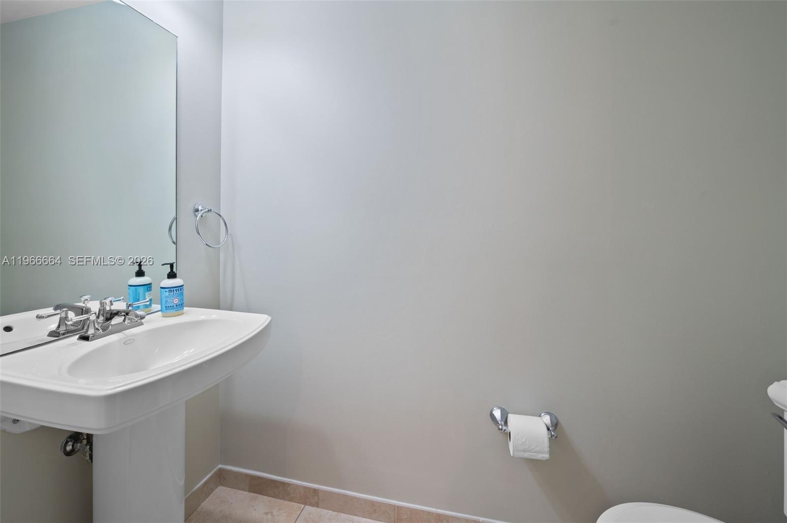 55 Merrick Way, Unit 507 Coral Gables, FL 33134 - Photo 10 of 28 a bathroom with a sink and a mirror