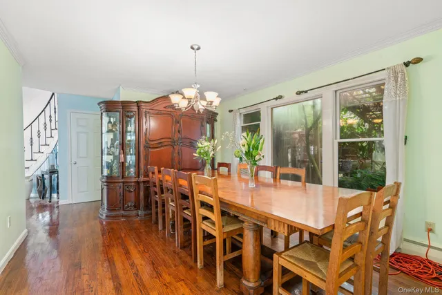 a view of green field with trees in the background