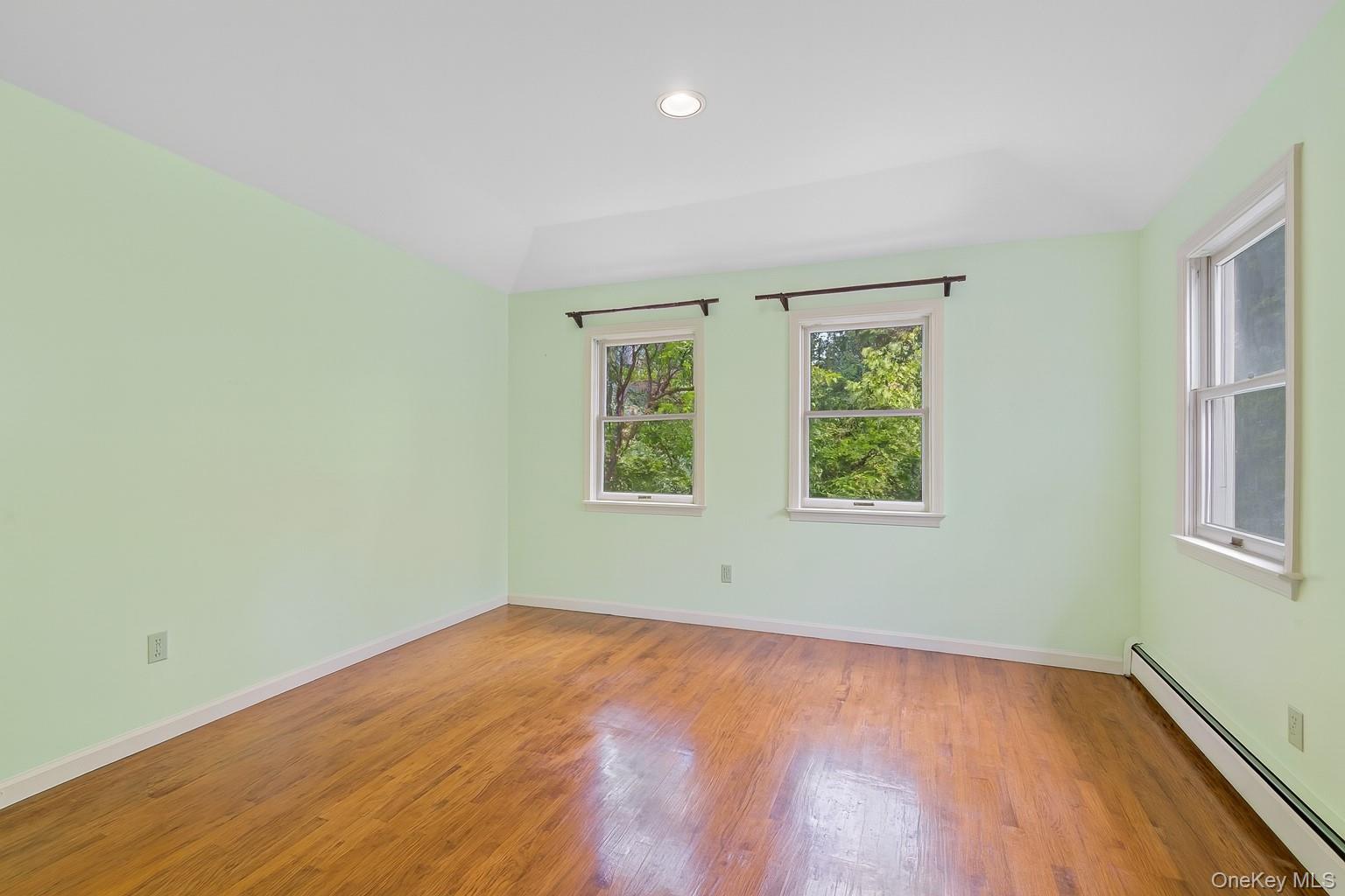 13 Whitney Circle Glen Cove, NY 11542 - Photo 21 of 44 Unfurnished room with a baseboard heating unit, light wood-type flooring, and recessed lighting