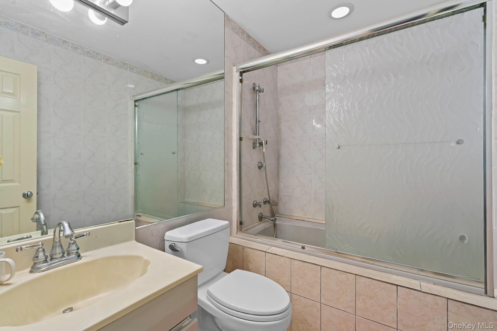 13 Whitney Circle Glen Cove, NY 11542 - Photo 22 of 44 Full bath with tiled shower / bath combo, vanity, and recessed lighting