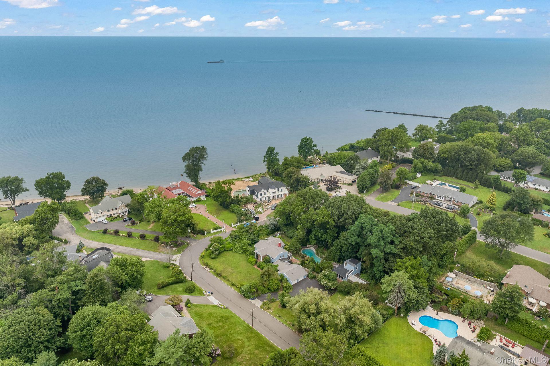 13 Whitney Circle Glen Cove, NY 11542 - Photo 3 of 44 Aerial perspective of suburban area featuring a large body of water