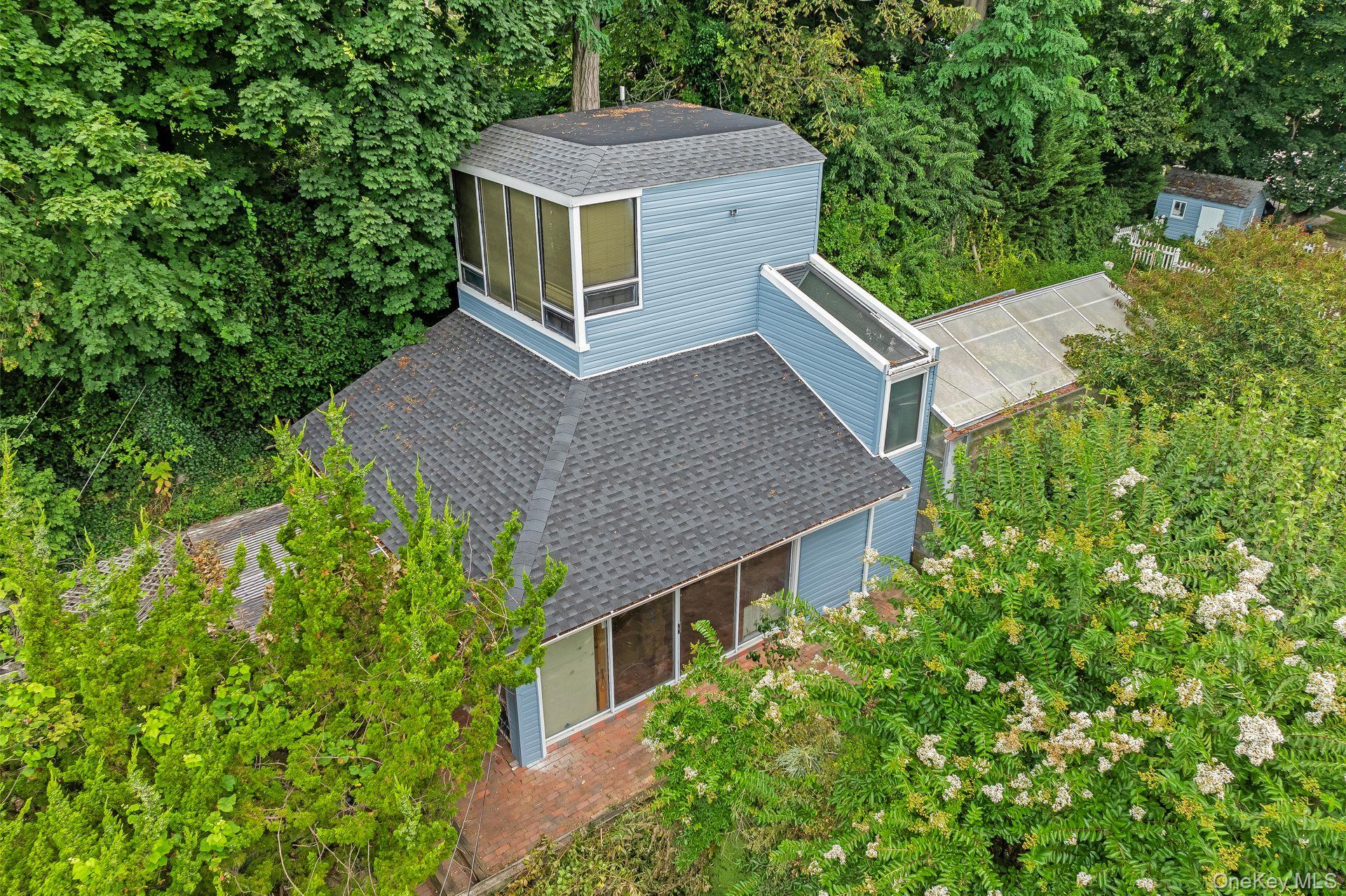 13 Whitney Circle Glen Cove, NY 11542 - Photo 31 of 44 View from above of property with a tree filled landscape