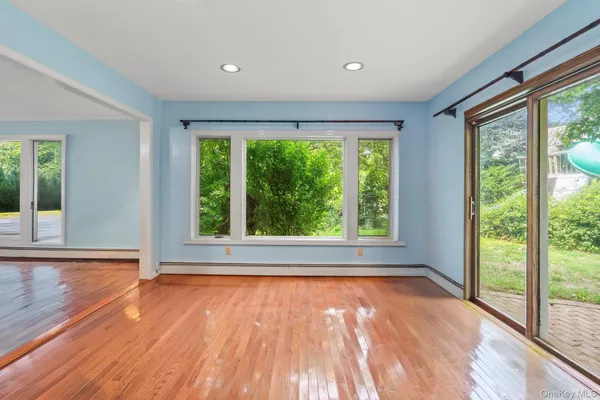 a view of a dining room with furniture window and outside view