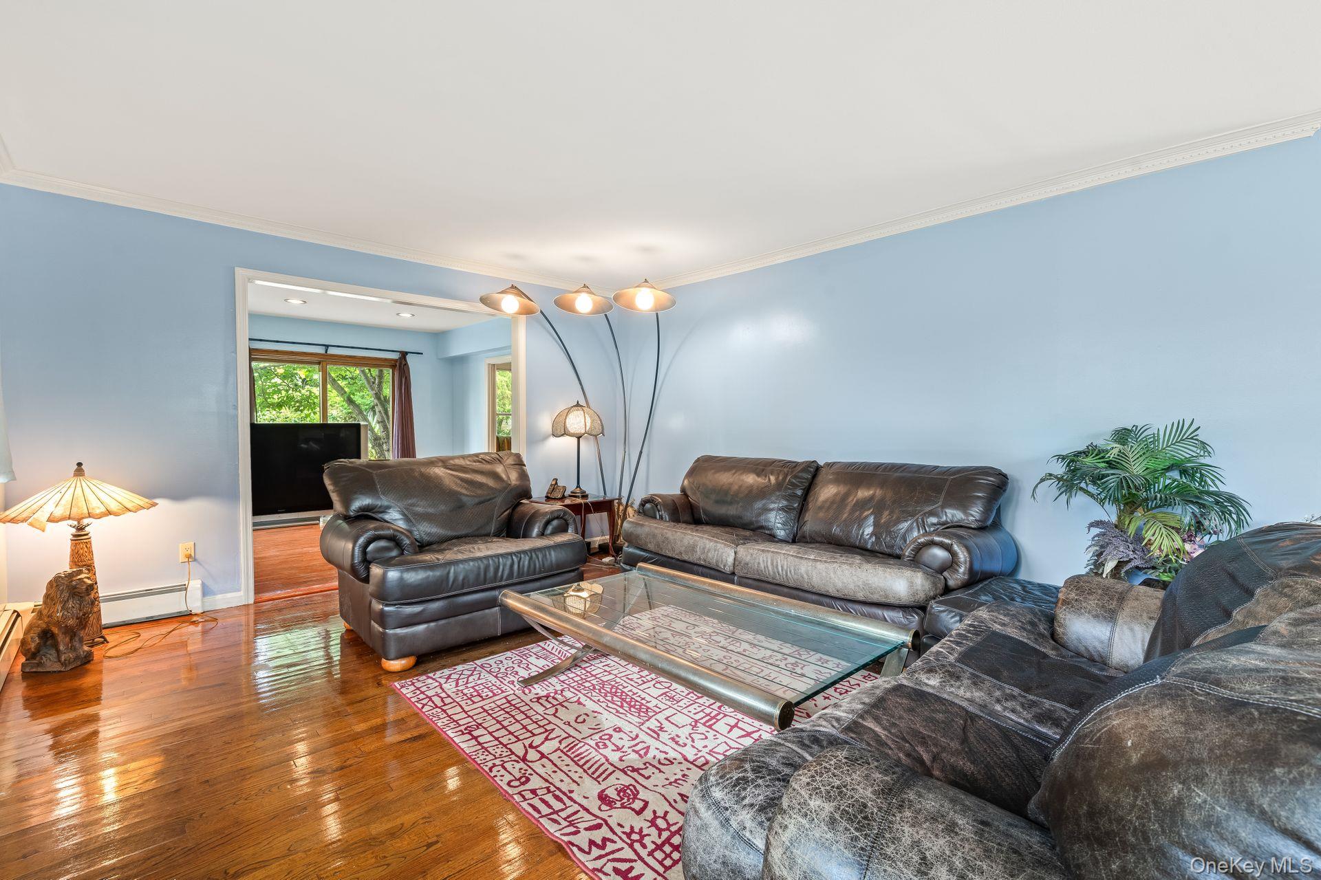 13 Whitney Circle Glen Cove, NY 11542 - Photo 7 of 44 a living room with furniture and wooden floor
