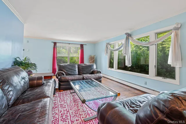 an empty room with furniture and white walls