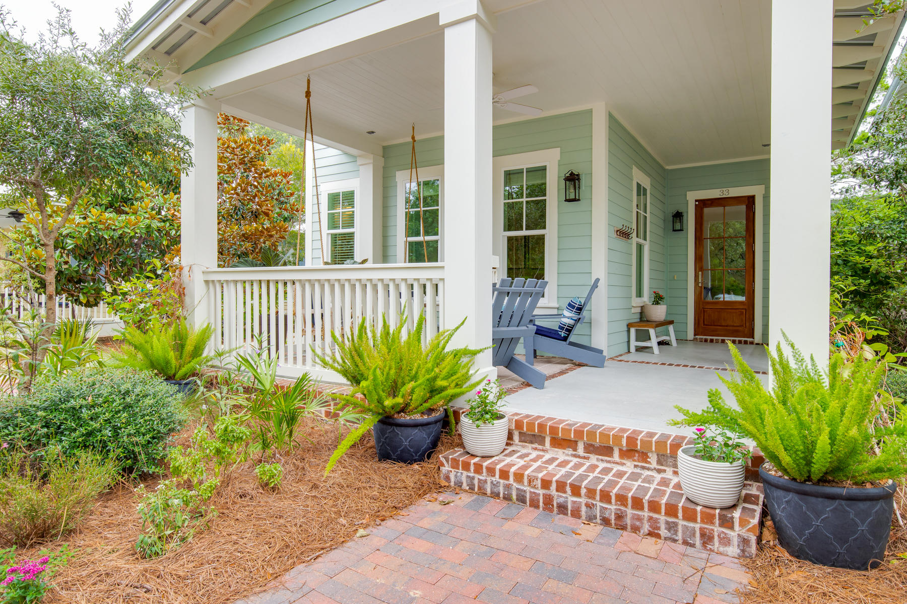 33 Pontchartrain North Santa Rosa Beach, FL 32459 - Photo 1 of 49 a potted plant sitting in front of a house