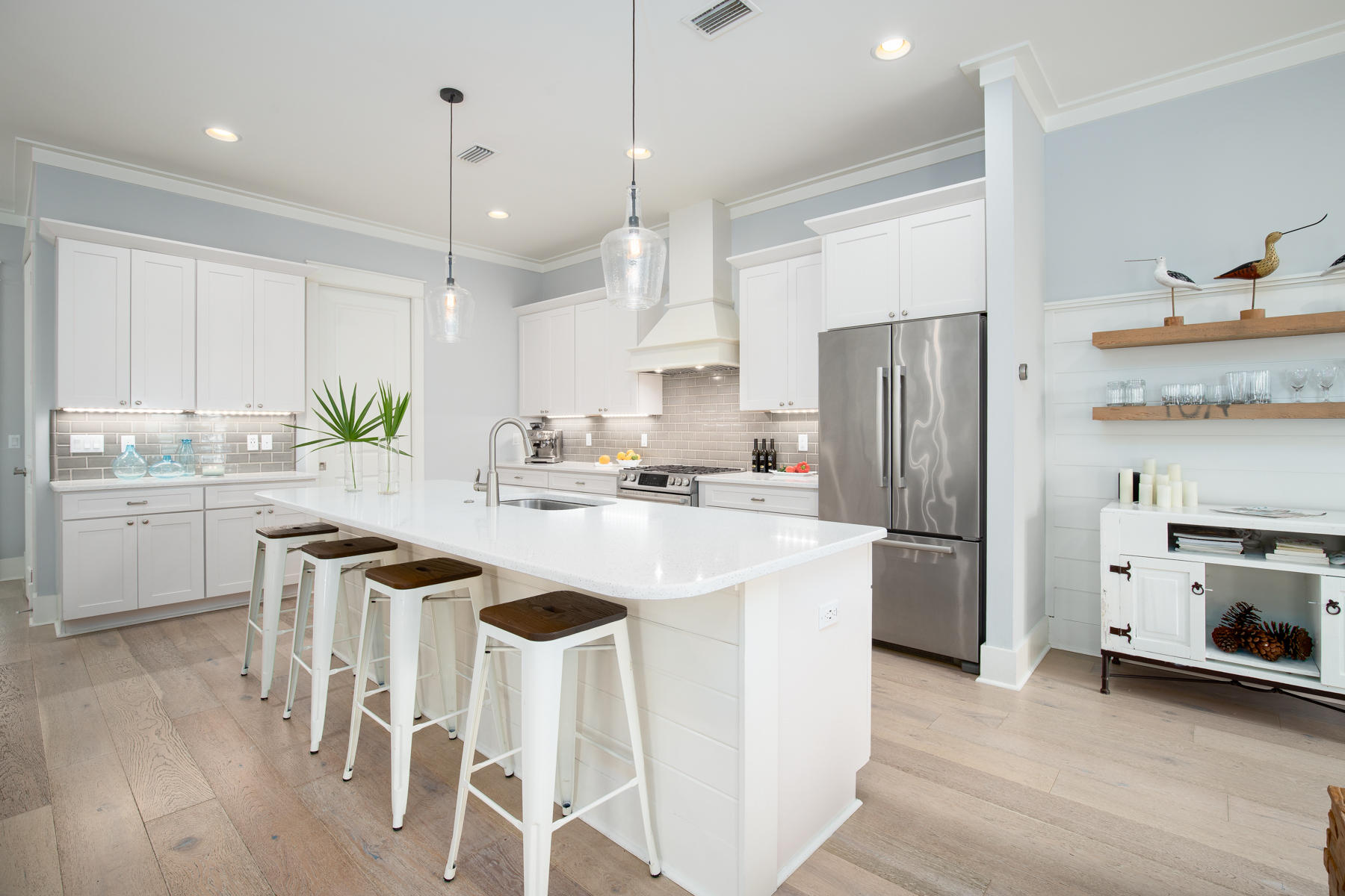 33 Pontchartrain North Santa Rosa Beach, FL 32459 - Photo 14 of 49 a kitchen with kitchen island white cabinets and stainless steel appliances