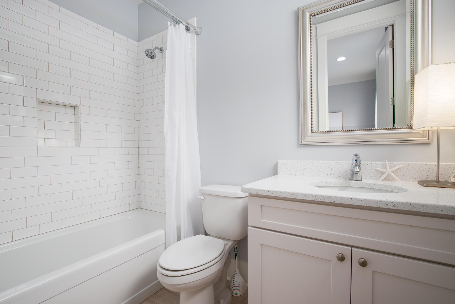 33 Pontchartrain North Santa Rosa Beach, FL 32459 - Photo 28 of 49 a bathroom with a granite countertop toilet sink a mirror and shower