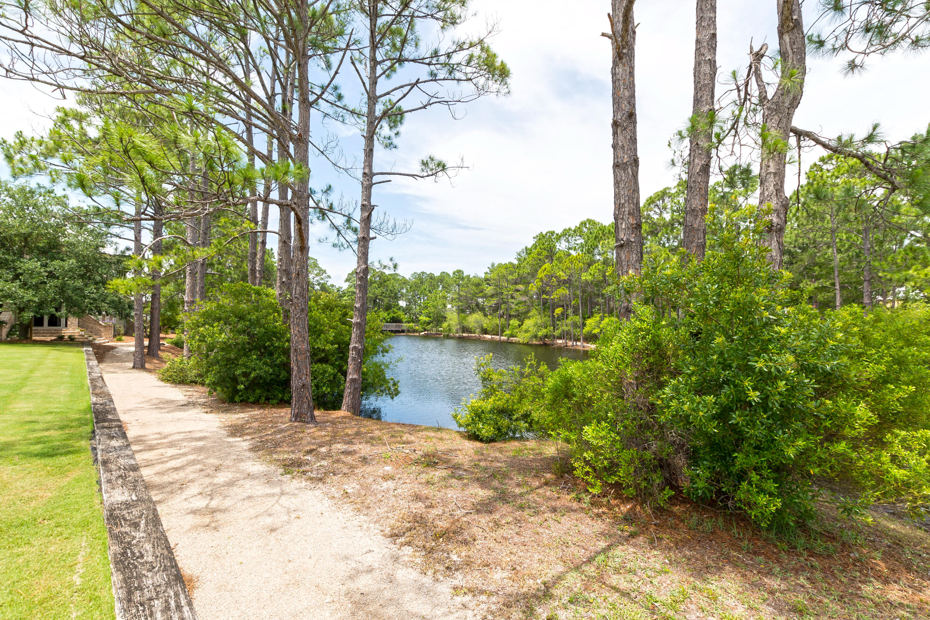 33 Pontchartrain North Santa Rosa Beach, FL 32459 - Photo 36 of 49 a backyard of a house with lots of green space and fountain