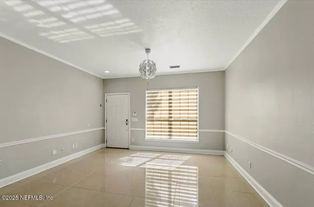 a view of an empty room and window