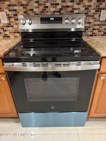 an aerial view of a house with outdoor space and garden view