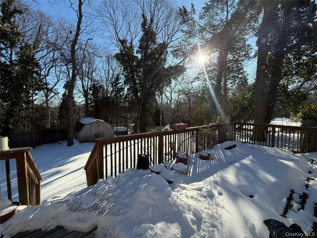a view of balcony with wooden floor and outdoor seating