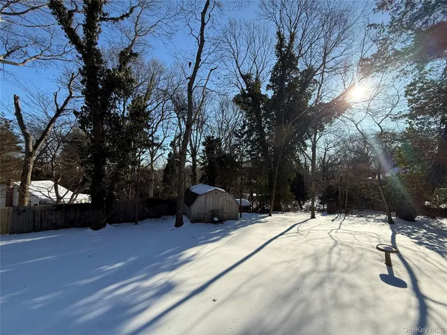 a view of outdoor space with lots of swings and slides