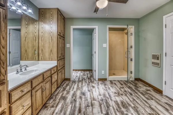 a bathroom with a sink and a mirror