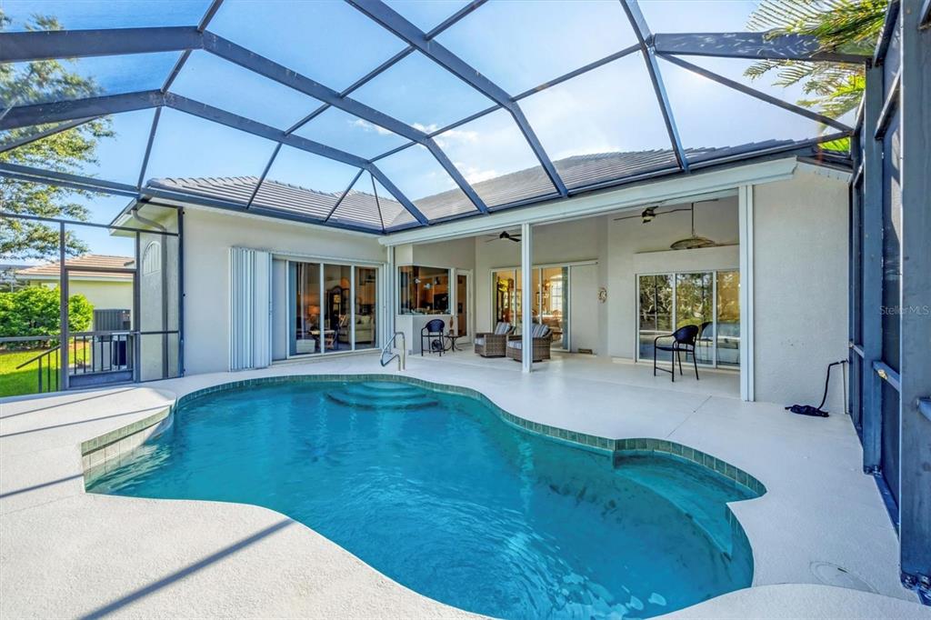 4 Windward Way Placida, FL 33946 - Photo 34 of 39 a view of swimming pool with outdoor seating