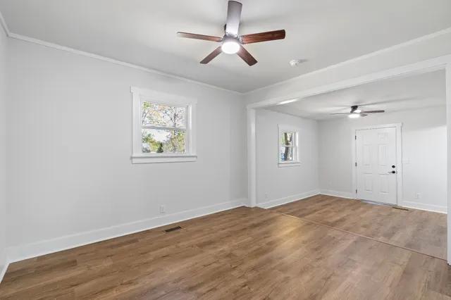 a view of an empty room with a window