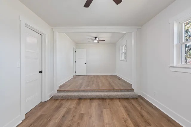 a view of livingroom with hardwood floor and a ceiling fan