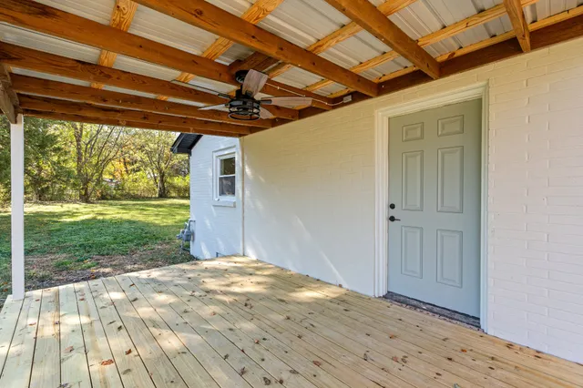 a view of backyard with wooden floor and roof