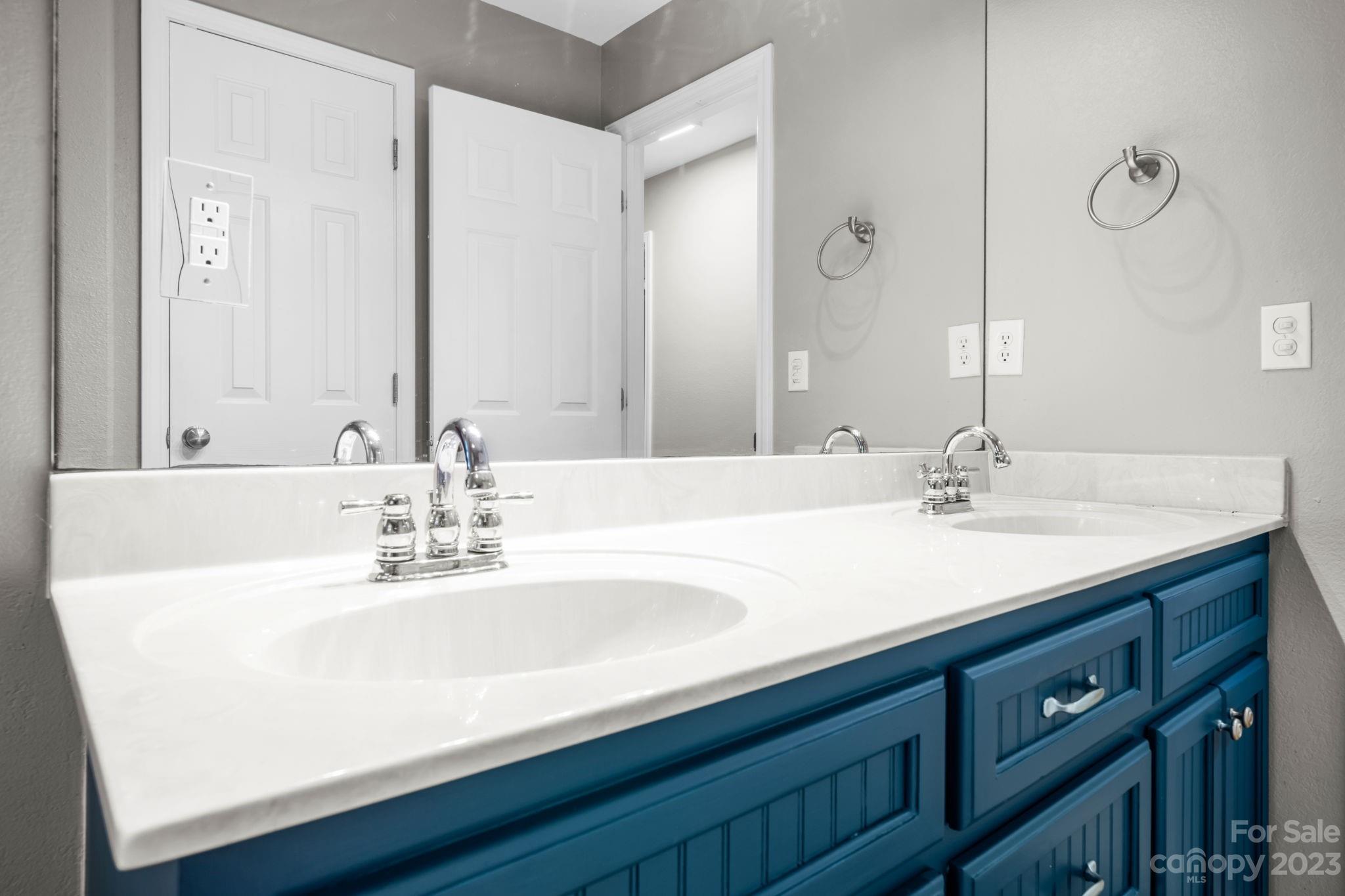 309 Sheldon Street Hudson, NC 28638 - Photo 12 of 40 a bathroom with a sink and a mirror