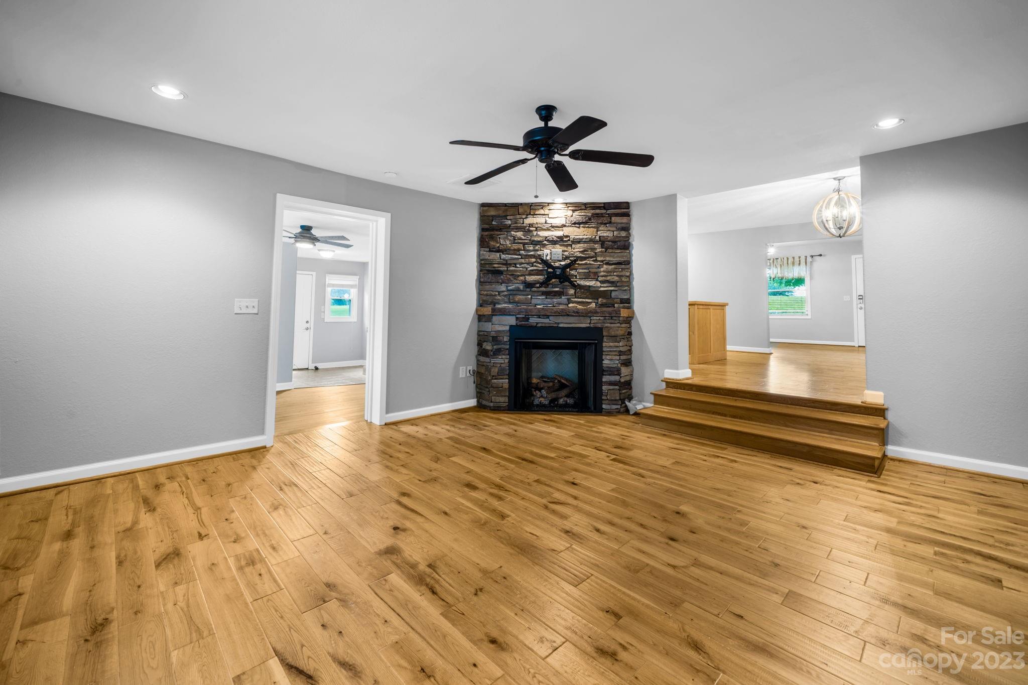 309 Sheldon Street Hudson, NC 28638 - Photo 16 of 40 a view of empty room with wooden floor and fan