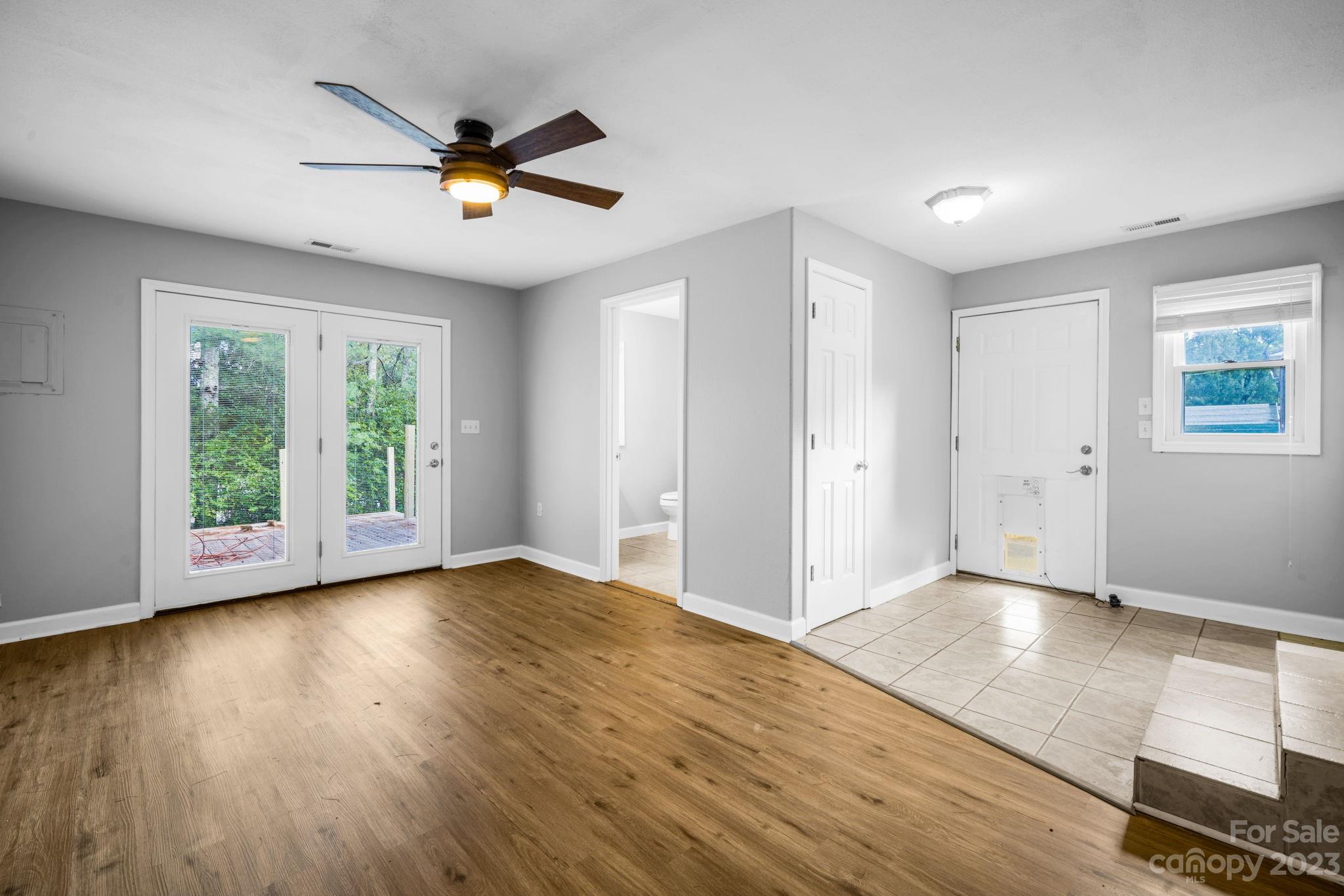 309 Sheldon Street Hudson, NC 28638 - Photo 17 of 40 a view of empty room with wooden floor and fan