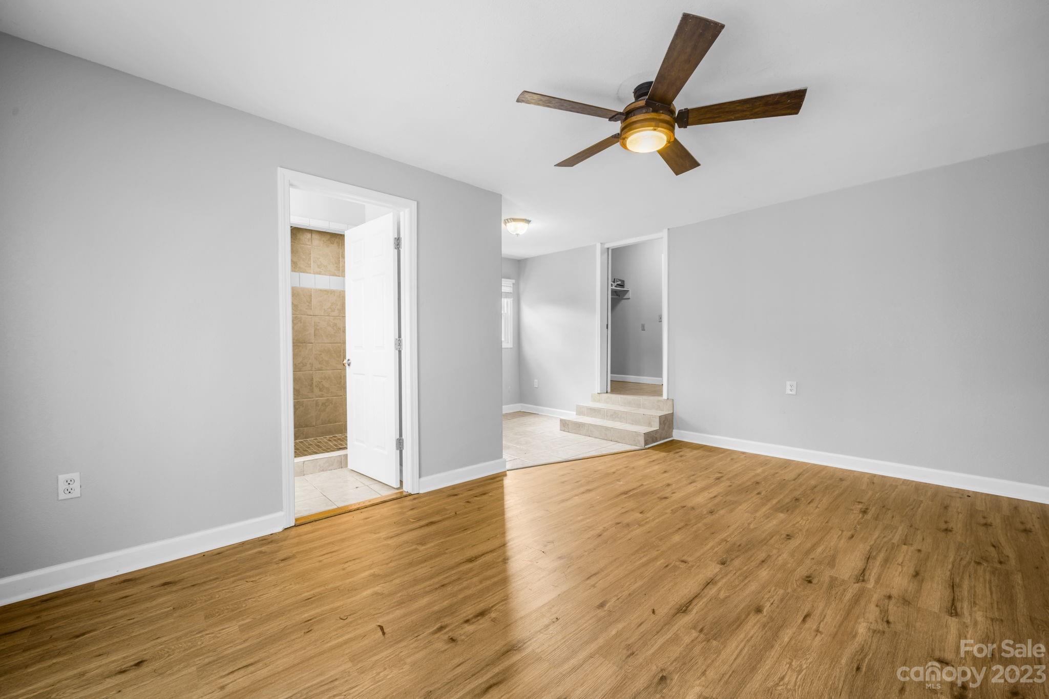 309 Sheldon Street Hudson, NC 28638 - Photo 18 of 40 a view of an empty room and wooden floor