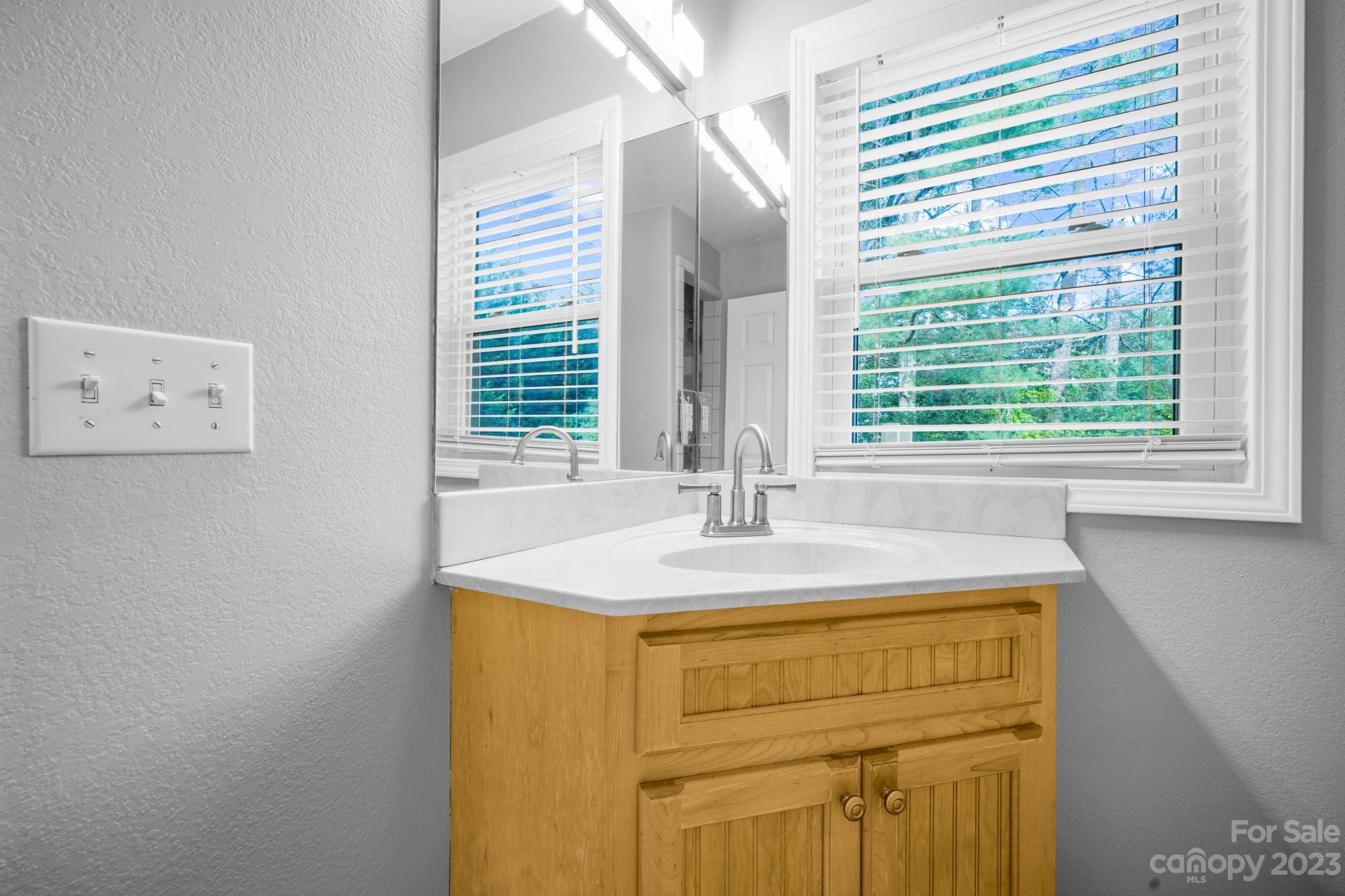 309 Sheldon Street Hudson, NC 28638 - Photo 20 of 40 a bathroom with a sink and a window